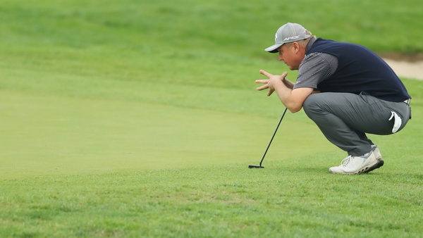 Ross McGowan lines up a putt on the 18th