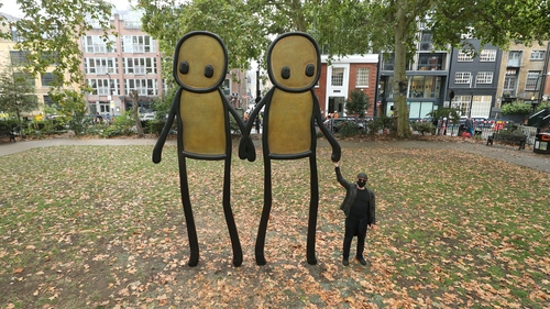 Prints of 'Holding Hands' were donated to residents of Hackney by the artist (pictured)