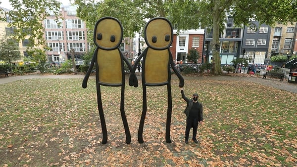 Prints of 'Holding Hands' were donated to residents of Hackney by the artist (pictured)