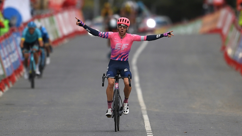 Michael Woods crosses the line to take stage seven