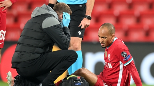 The Brazilian receiving treatment on the Anfield pitch