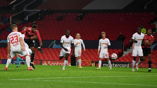 Marcus Rashford scores Manchester United's fifth goal on the night to complete his hat-trick