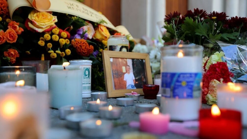 Candles are lit in front of the Notre-Dame de l'Assomption Basilica in Nice in memory of those who died
