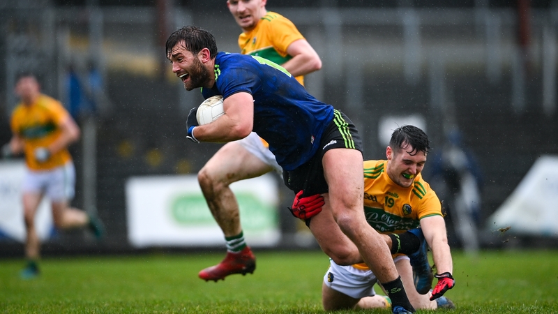 Aidan O'Shea is tackled by Oisin Mac Cafraigh