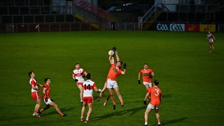 Jarly Og Burns competes in the air with Derry's Conor Glass