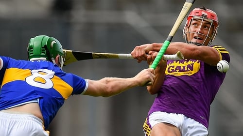 Noel McGrath blocks Lee Chin's shot during last year's All-Ireland semi-final