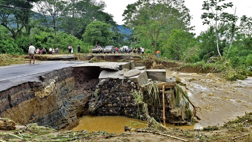 A collapsed road in Honduras following Storm Eta