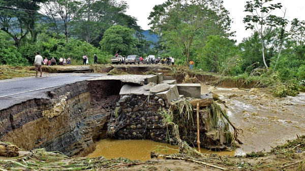 A collapsed road in Honduras following Storm Eta