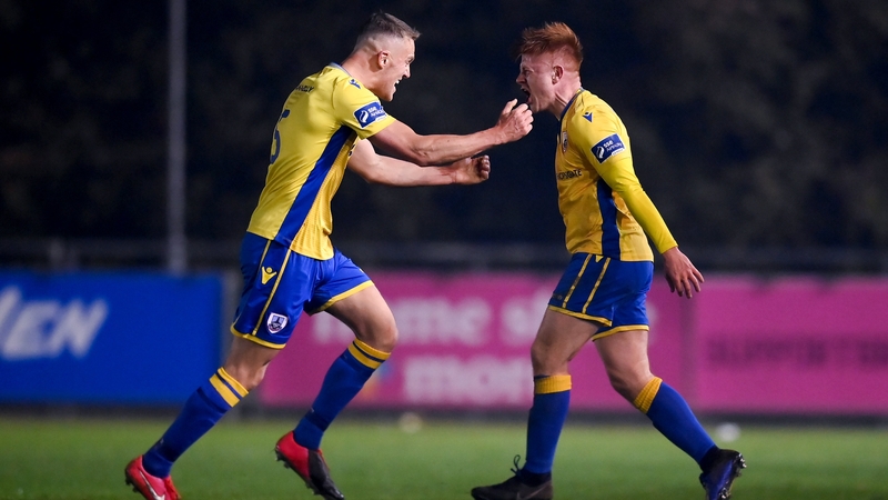 Longford Town's Aodh Dervin, right, celebrates after scoring his side's second goal with team-mate Mick McDonnell