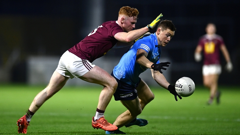 Con O'Callaghan being pursued by Ronan Wallace