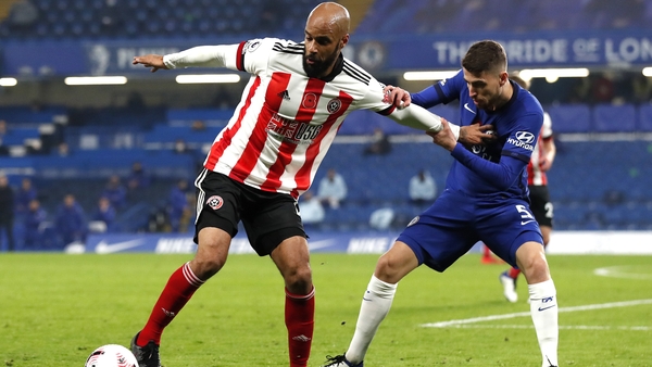 David McGoldrick and Jorginho battle for possession