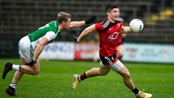 Daniel McGuinness of Down in action against Cain McManus of Fermanagh