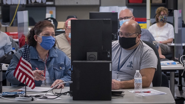 Adjudicators continue to check ballots at the Maricopa County Recorder's Office in Phoenix, Arizona