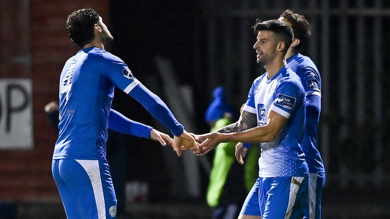 Adam Foley (r) celebrates his crucial goal