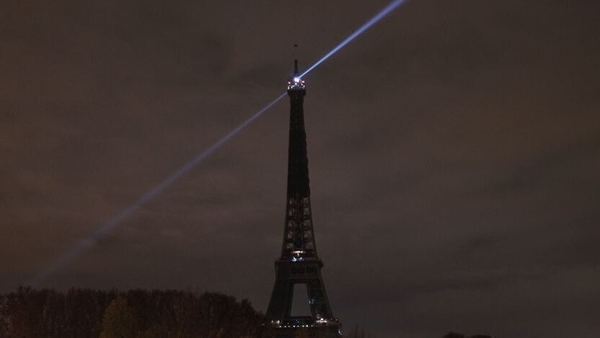 The lights of the Eiffel tower are switched off to pay tribute to the victims