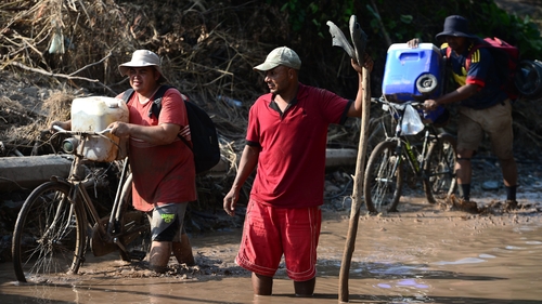Banana field workers in Honduras evacuate the area before the arrival of Hurricane Iota