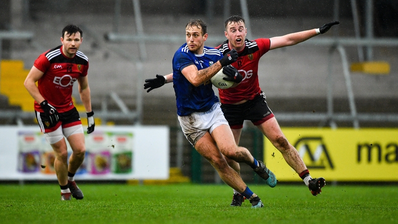 Pádraig Faulkner of Cavan in action against Paul Devlin of Down