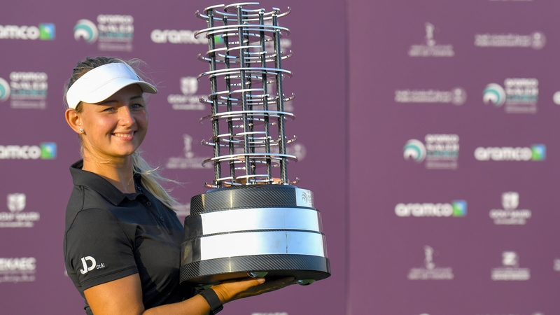 Pedersen celebrates with the trophy