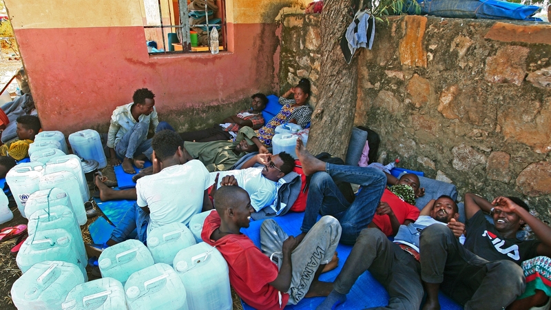Ethiopian refugees, who fled intense fighting in their homeland, gather in the Um Raquba camp in Sudan