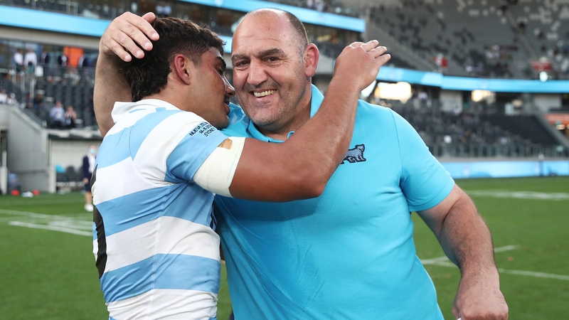 Argentina head coach Mario Ledesma (R) celebrates with Santiago Carreras after beating New Zealand