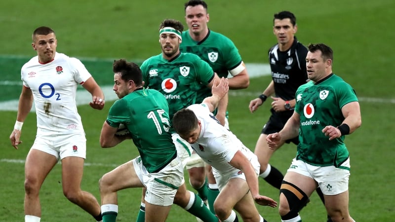 Owen Farrell tries to halt Hugo Keenan's progress