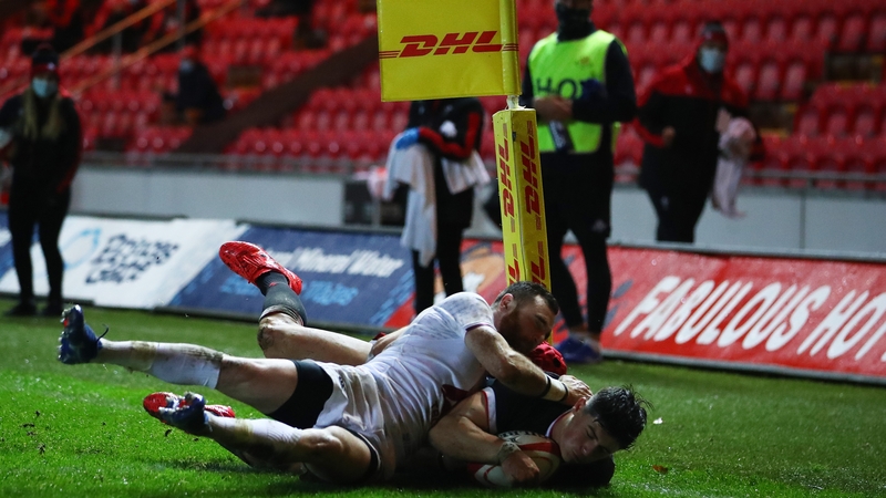 Louis Rees-Zammit scores Wales' first try as Otar Giorgadze and Vasil Lobzhanidze attempt to tackle