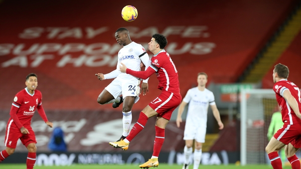 Nampalys Mendy of Leicester City rises with Curtis Jones