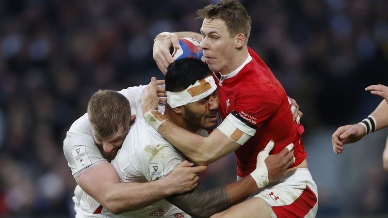 Liam Williams crashes into Manu Tuilagi and George Kruis during last March's Six Nations clash