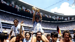 The Argentina captain holds the World Cup trophy aloft