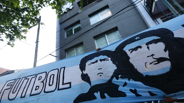 An Argentina flag depicting Maradona Che Guevara hangs outside of clinic in where the former was recently treated for a clot on his brain
