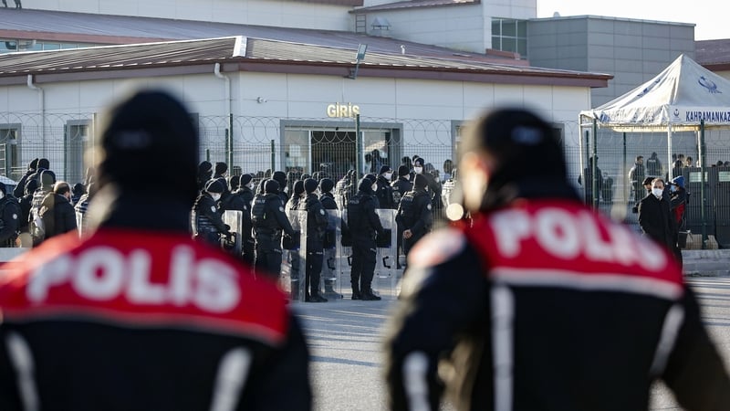 Turkish police officers stand guard outside a Turkish court in Ankara