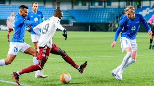 Nicolas Pepe (C) vies for the ball with Molde's Etzaz Hussein (L) a