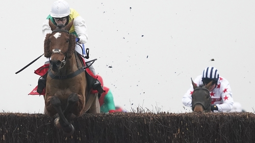 Tom Scudamore and Cloth Cap clear the last to win The Ladbrokes Trophy Chase at Newbury.
