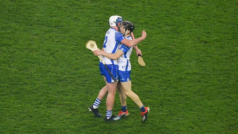 Stephen Bennett celebrates at the full-time whistle with Jamie Barron
