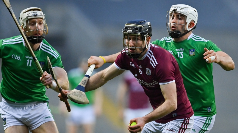 Padraic Mannion of Galway in action against Limerick's Cian Lynch and Aaron Gillane.