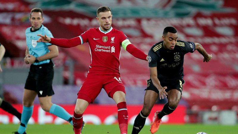 Ryan Gravenberch (R) in action against former Liverpool midfielder Jordan Henderson
