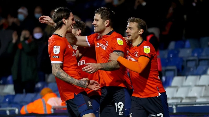 James Collins is mobbed after his goal