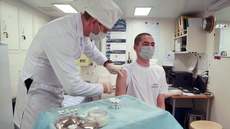 A Russian Northern Fleet serviceman gets a Covid-19 vaccine aboard the frigate Admiral Kasatonov in the town of Severomorsk