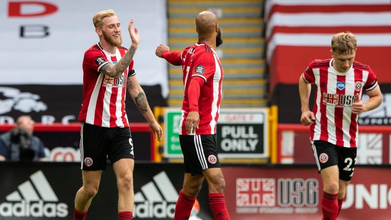 David McGoldrick congratulates Oli mcBurnie on his Premier League goal against Chelsea last July