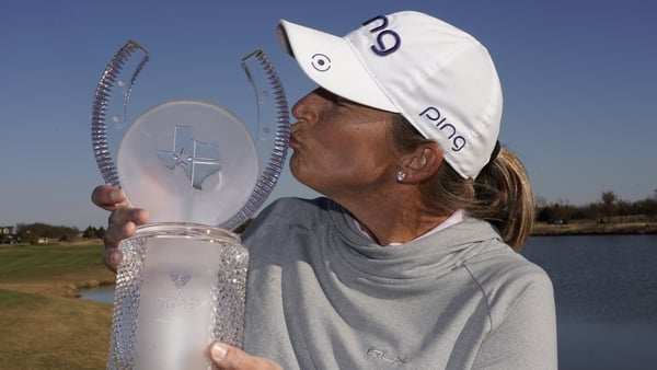 Angela Stanford kisses the trophy