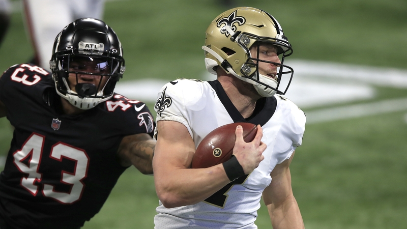 Saints quarterback Taysom Hill evades Falcons linebacker Mykal Walker