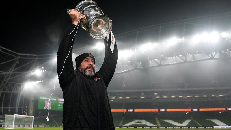 Filippo Giovagnoli hoists the FAI Cup following his side's 4-2 extra-time victory over Shamrock Rovers