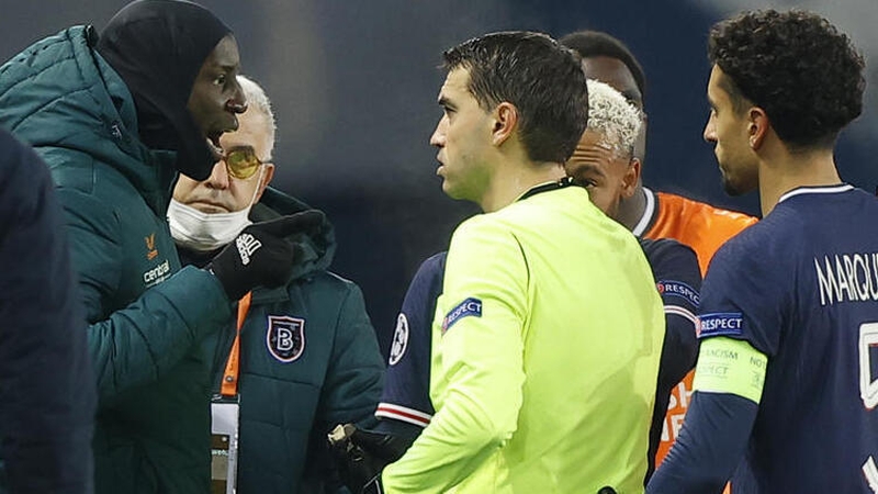 Basaksehir's Demba Ba (L) speaks to referee Ovidiu Hategan on Tuesday night