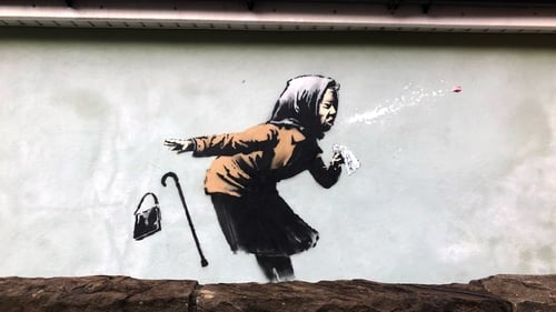 The image is on the exterior wall of a house on Vale Street in Bristol, the steepest street in England