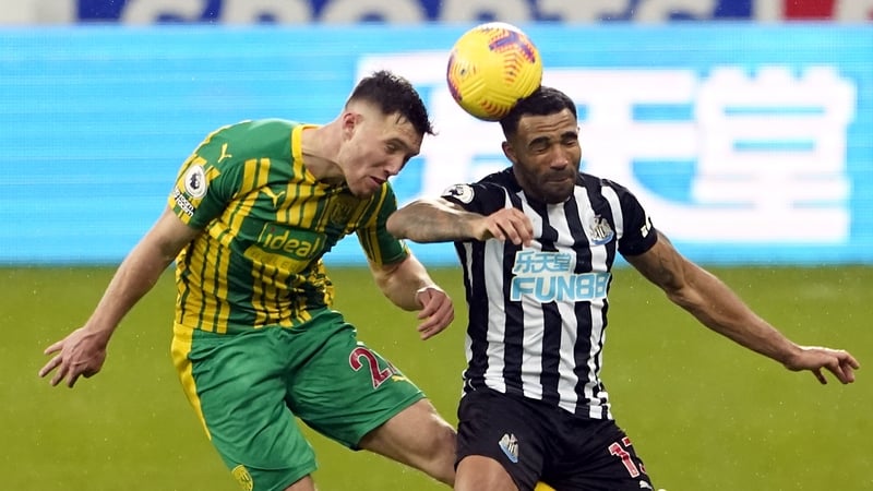 Dara O'Shea competes with Callum Wilson of Newcastle