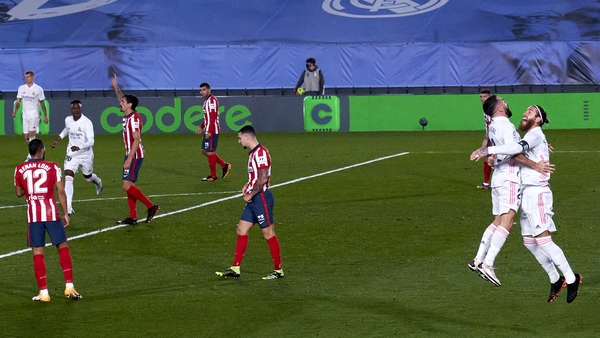 Real win Madrid derby to close gap at the top