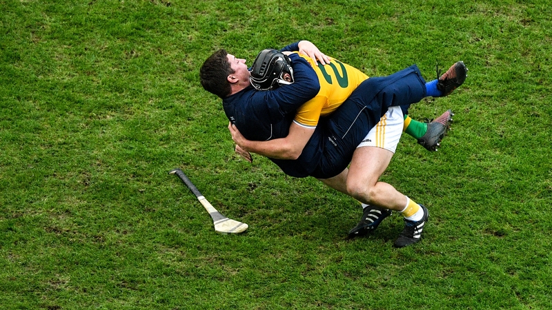 Donal Nugent and Darren Gleeson celebrate Antrim's win in rambunctious style
