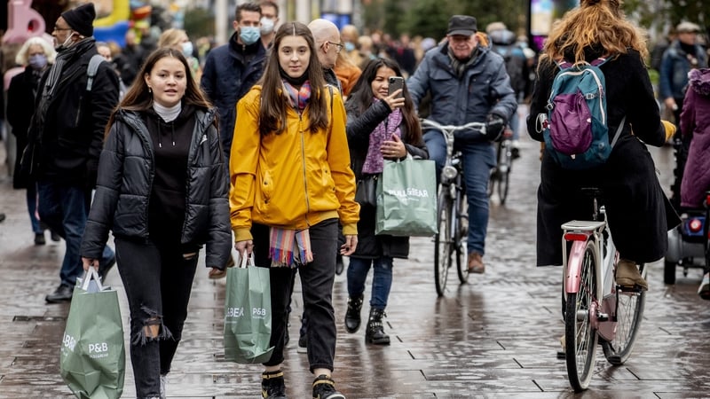 Shoppers are seen in on a crowded street in The Hague