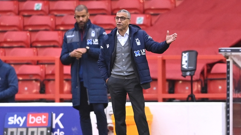 Chris Hughton and Forest first team coach and fellow former Ireland international Steven Reid (l)