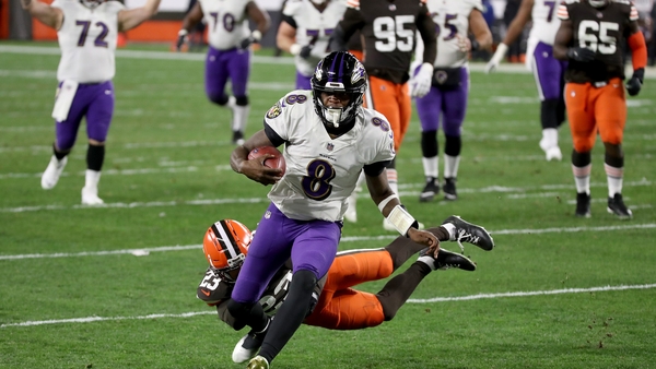 Baltimore Ravens quarterback Lamar Jackson runs in a touchdown during the second quarter